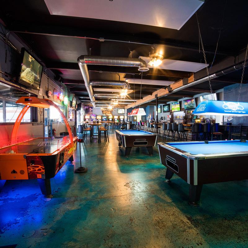 Arcade and pool area at Brewski's San Diego